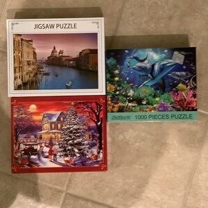 Three 1000 piece puzzles with letters on back